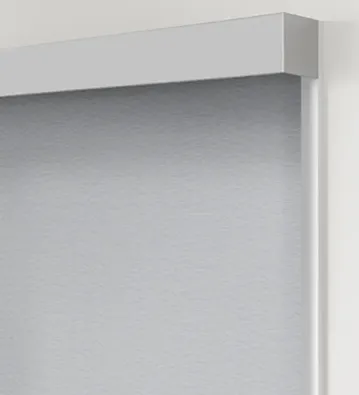 Gray roller shade with white frame.