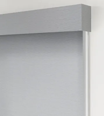 Gray roller blind with valance on wall