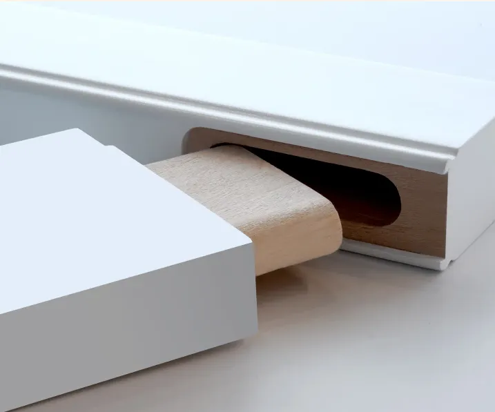 Wooden block sliding into white rectangular slot.