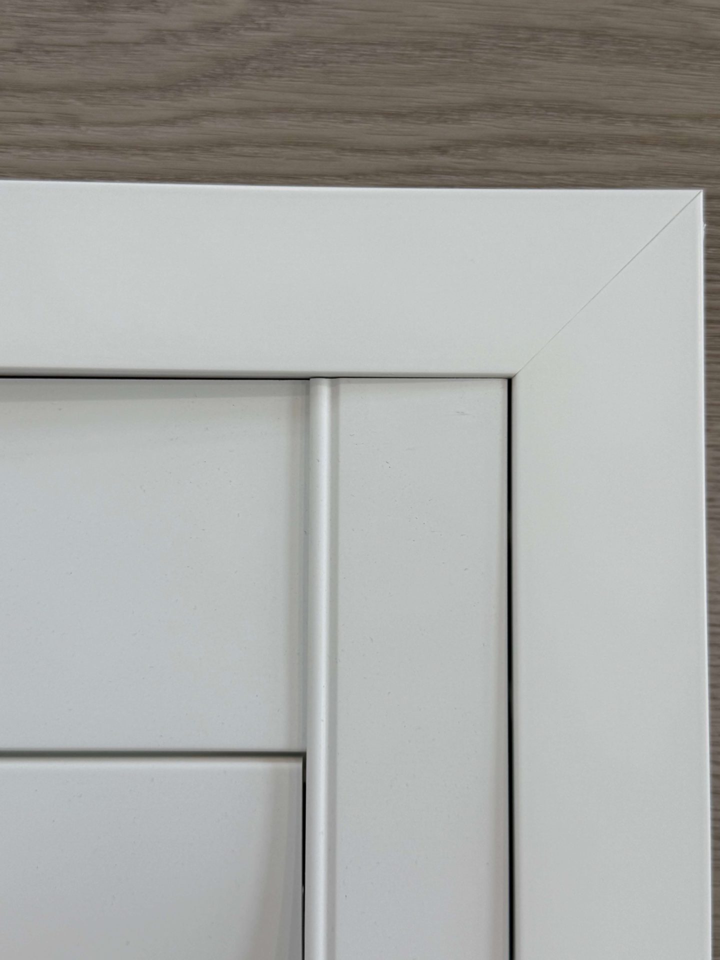 Close-up of white door corner detail